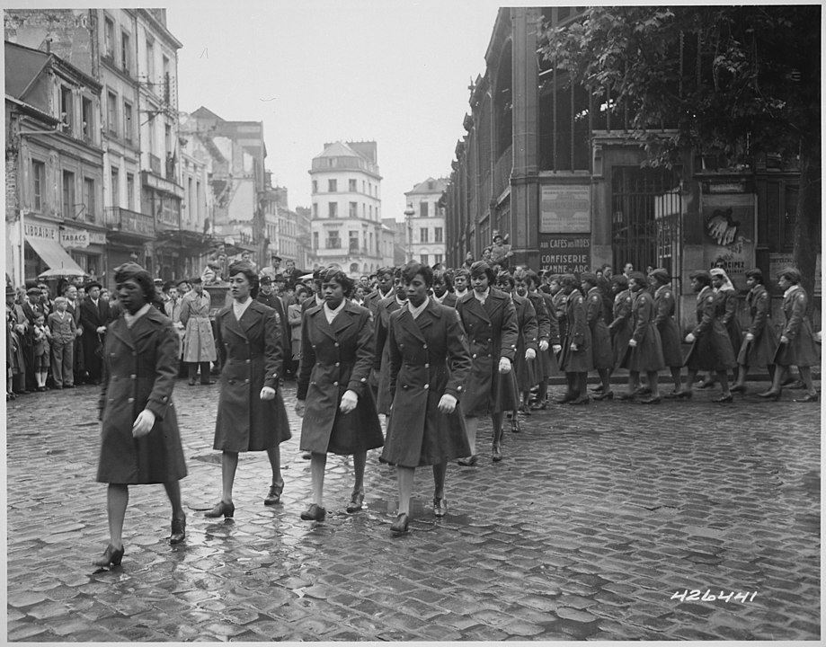 Members of the 6888th Central Postal Directory Battalion take part in a parade ceremony in honor of Joan d'Arc in France (Photo via Wikicommons https://en.wikipedia.org/wiki/6888th_Central_Postal_Directory_Battalion#/media/File:Members_of_the_6888th_Central_Postal_Directory_Battalion_take_part_in_a_parade_ceremony_in_honor_of_Joan_d'Arc_at_the_marketplace_where_she_was_burned_at_the_stake.jpg)