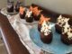 Chocolate cupcakes with black, orange and white cats on top, make of candy melts.