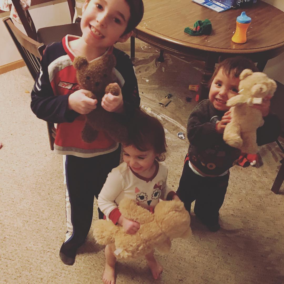 The three Carlson kids show off their teddy bear friends.