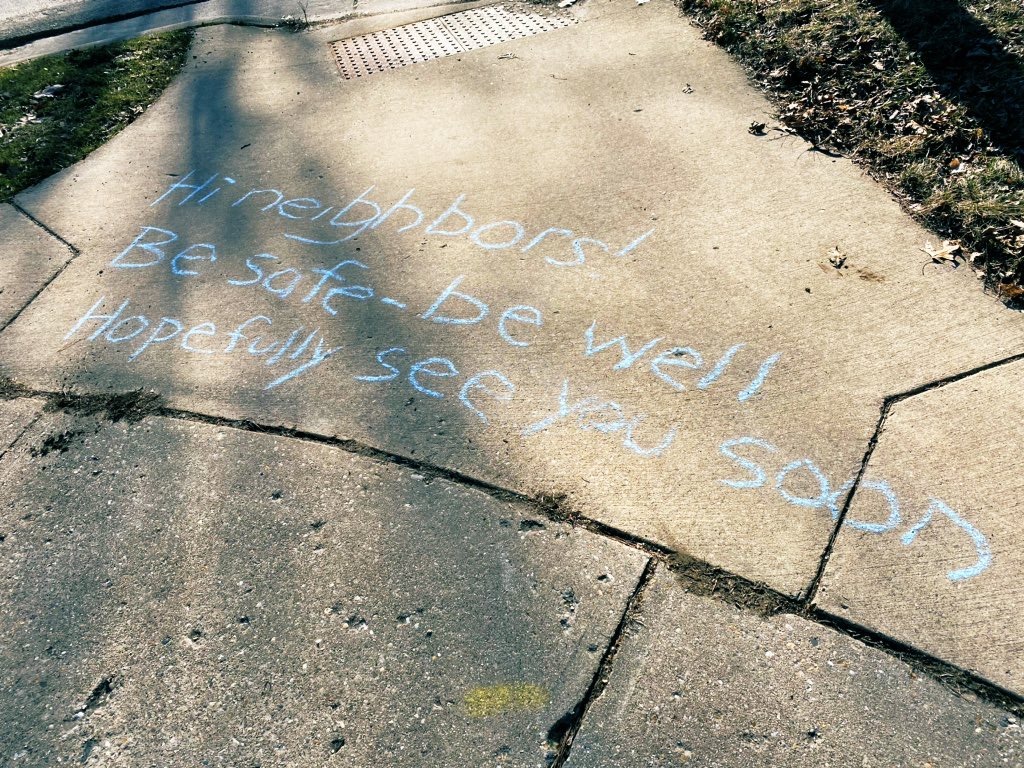 Sidewalk message in blue chalk: "Hi neighbors! Be safe - be well, hopefully see you soon"