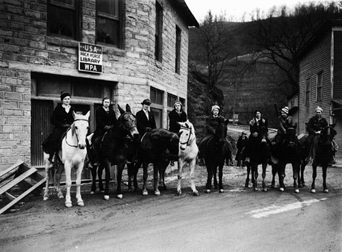Pack Horse Librarians in Hindman, Kentucky. (Photo via Wikicommons https://en.wikipedia.org/wiki/Pack_Horse_Library_Project#/media/File:Carriers_in_Hindman,_KY.gif)