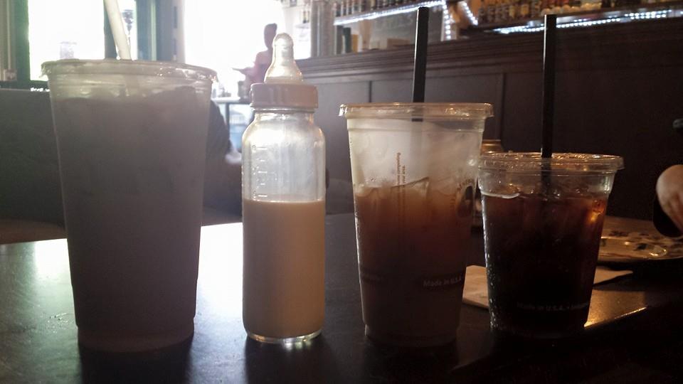 From left to right: large iced latte, baby bottle, medium iced coffee, small Italian soda.