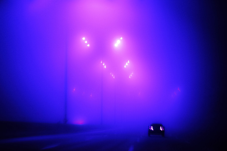 Street lights on a foggy night. (Photo by Natalia Medd via Flickr/Creative Commons https://flic.kr/p/TcZJ4L)