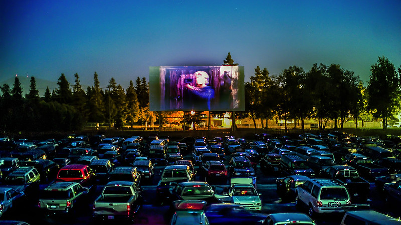 Cars parked at a drive-in theater. (Photo by Thomas Hawk via Flickr/Creative Commons https://flic.kr/p/orzAN5)