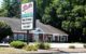 A sign says "Sal's Pizza" - underneath it the sign reads "Milford District Court"