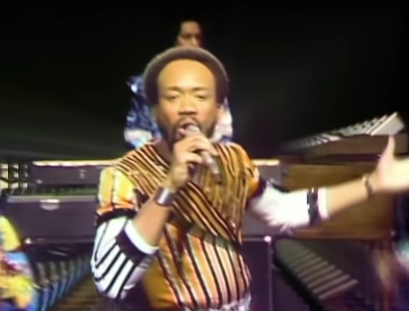 Screen capture from the video for Earth, Wind & Fire's "September showing Maurice White singing.