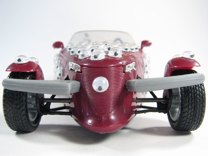 A brick red miniature race car covered in googly eyes. (Photo by Lenore Edman via Flickr/Creative Commons https://flic.kr/p/4ARz5J)