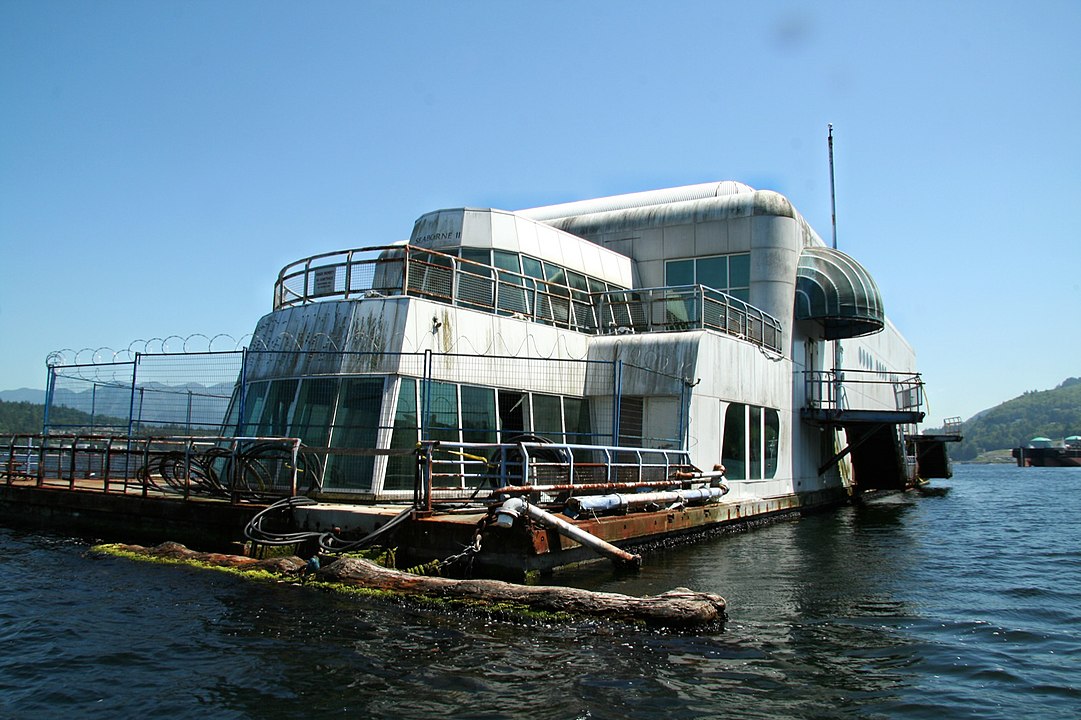 Friendship 500, a floating McDonald's restaurant, also known as the McBarge, anchored in Burrard Inlet near Vancouver, BC. (Photo by Taz - originally posted to Flickr as McBarge, CC BY 2.0, via Wikicommons https://en.wikipedia.org/wiki/McBarge#/media/File:McBarge_front.jpg)