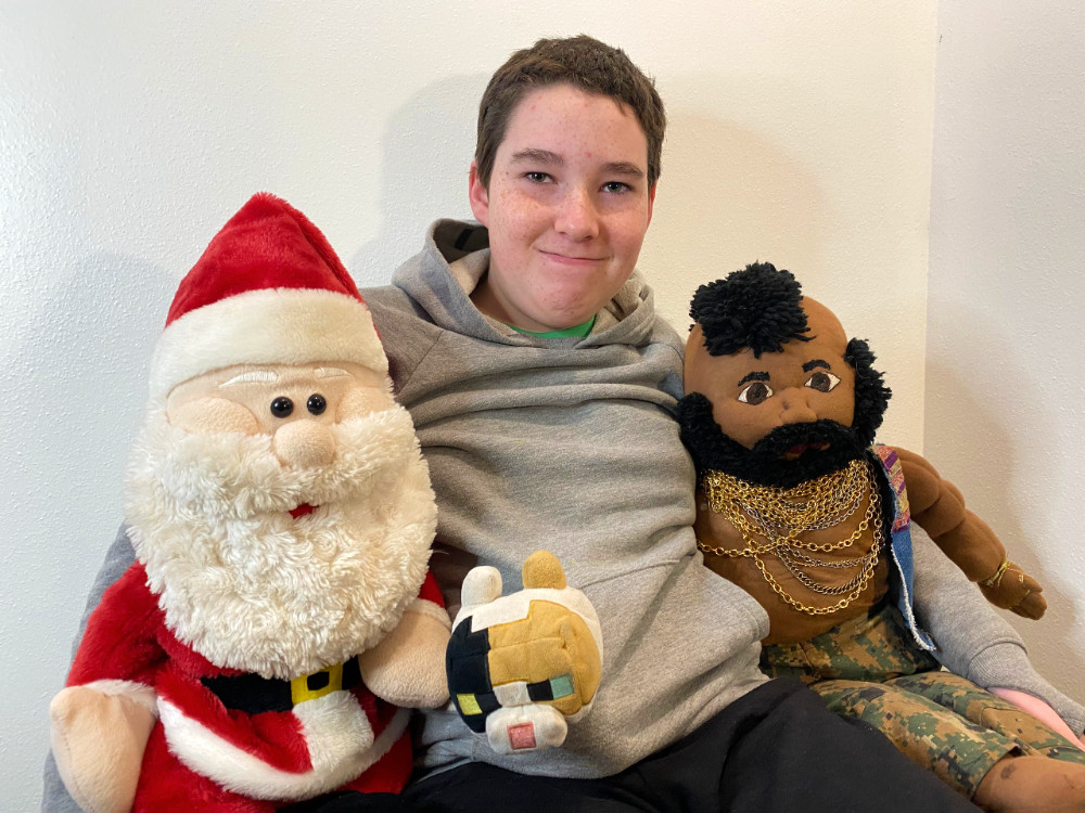 Eleven year old with Santa, Mr. T and Nosy the Minecraft cat