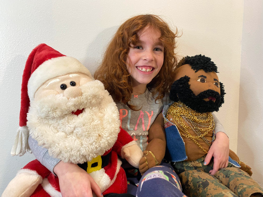 Seven year old with Santa and Mr. T
