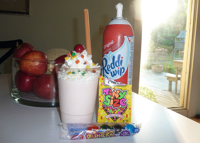 A milkshake with a can of Reddi-wip next to it. (Photo by Jagrap via Flickr/Creative Commons https://flic.kr/p/a8ttMp)