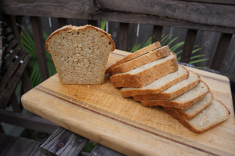 A loaf of sliced bread on a wooden cutting board. (Photo by Bart Everson via Flickr/Creative Commons https://flic.kr/p/dErQ3a)
