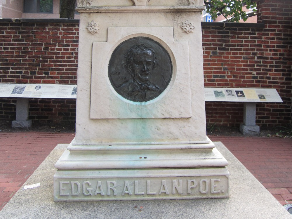 Lower half of the Edgar Allan Poe monument at his gravesite in Baltimore. (Photo by Grant Berg via Wikicommons https://commons.wikimedia.org/wiki/File:Edgar_Allan_Poe_Grave_-_panoramio.jpg)