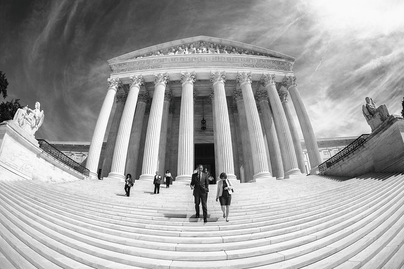 A black and white photo of the Supreme Court building in Washington through a fisheye lens. (Photo by Thomas Hawk via Flickr/Creative Commons https://flic.kr/p/2itUqXh)