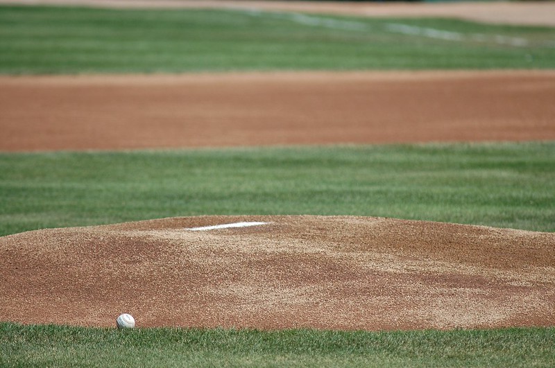 A baseball next to a pitcher's mound. (Photo by Joel Dinda via Flickr/Creative Commons https://flic.kr/p/cnnSS)