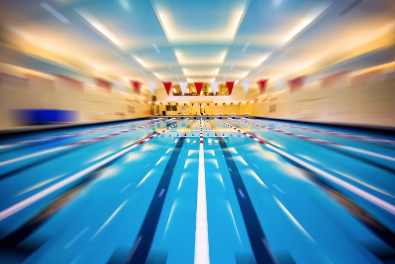 Stylized photo of an Olympic-sized swimming pool. (Photo by Thomas Hawk via Flickr/Creative Commons https://flic.kr/p/V3DPxL)