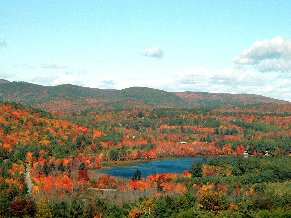 A look down at a valley full of bright fall New Hampshire colors, as taken in 2002.