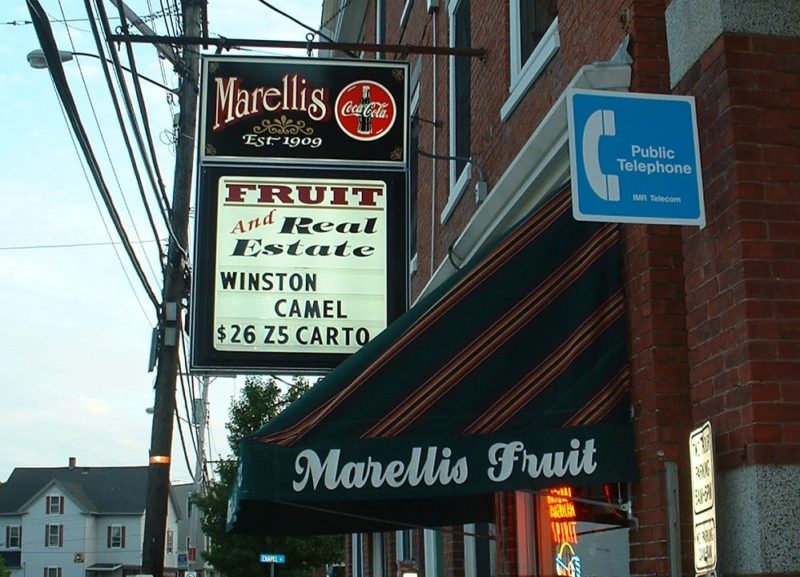 A sign that reads "Marelli's Fruit and Real Estate"