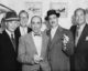 The five Marx Brothers together at an appearance on NBC's The Tonight Show. Left to right: Harpo, Zeppo, Chico, Groucho and Gummo. (Photo by Ethel Kirsner, NBC Press via Wikicommons https://commons.wikimedia.org/wiki/Category:Marx_Brothers#/media/File:Marx_brothers_Tonight_Show.jpg)