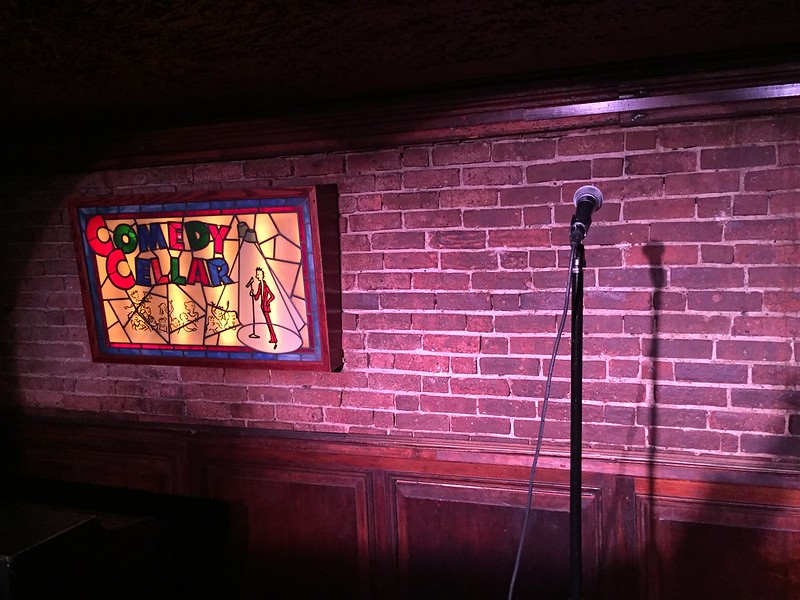 A microphone in front of a brick wall at the Comedy Cellar. (Photo by Gus Taf via Flickr/Creative Commons https://flic.kr/p/xtN7Xb)