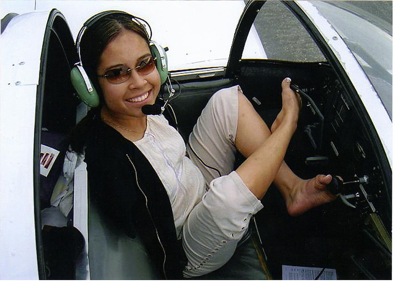 Jessica Cox in an airplane cockpit. (Photo by Pearl Harbor Aviation Museum via Flickr/Creative Commons https://flic.kr/p/qMLg7E)
