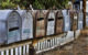 A row of old-style metal mailboxes. (Photo by Pam Lane via Flickr/Creative Commons https://flic.kr/p/8v1wjj)