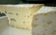 A close up on two wedges of blue cheese. (Photo by cookbookman17 via Flickr/Creative Commons https://flic.kr/p/apJkXi)