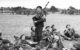 Bill Millin playing the bagpipes in 1944. (Photo by War Office official photographer, Evans, J L (Capt), via Imperial War Museums/Wikicommons https://en.wikipedia.org/wiki/Bill_Millin#/media/File:Bill_Millin_1944.jpg)