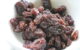 A close-up of raisins in a white bowl. (Photo by Mariam via Flickr/Creative Commons https://flic.kr/p/4Smo9Y)