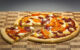 A pizza with a slice cut out. (Photo by russellstreet via Flickr/Creative Commons https://flic.kr/p/eYjnzD)