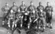 The Wyoming State Prison All Stars baseball team; their "mascot," Felix Alston, Jr. sits center. (Photo by Mark Frederick Jukes via Wikicommons https://en.wikipedia.org/wiki/Wyoming_State_Penitentiary_All_Stars#/media/File:Wyoming_State_Penitentiary_All_Stars.jpg)
