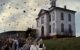 In a scene from "The Birds," a group of children, plus Tippi Hedren, run from a mass of birds.