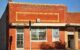 A red brick building with the words SKIDMORE CITY HALL on the front window. Photo by David Meyer via Flickr/Creative Commons https://flic.kr/p/PtAsHm