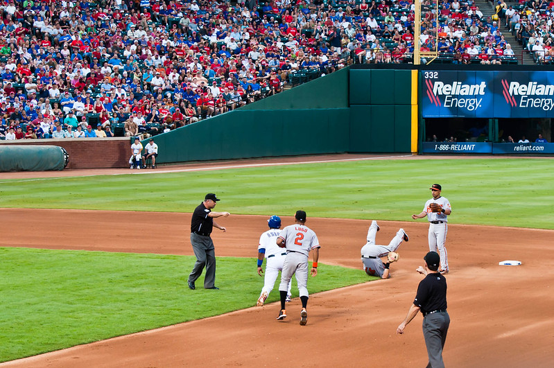 A rundown in baseball, in which one of the infielders someone turns upside down with his legs in the air. (Photo by Rich Anderson via Flickr/Creative Commons https://flic.kr/p/8jU74x)